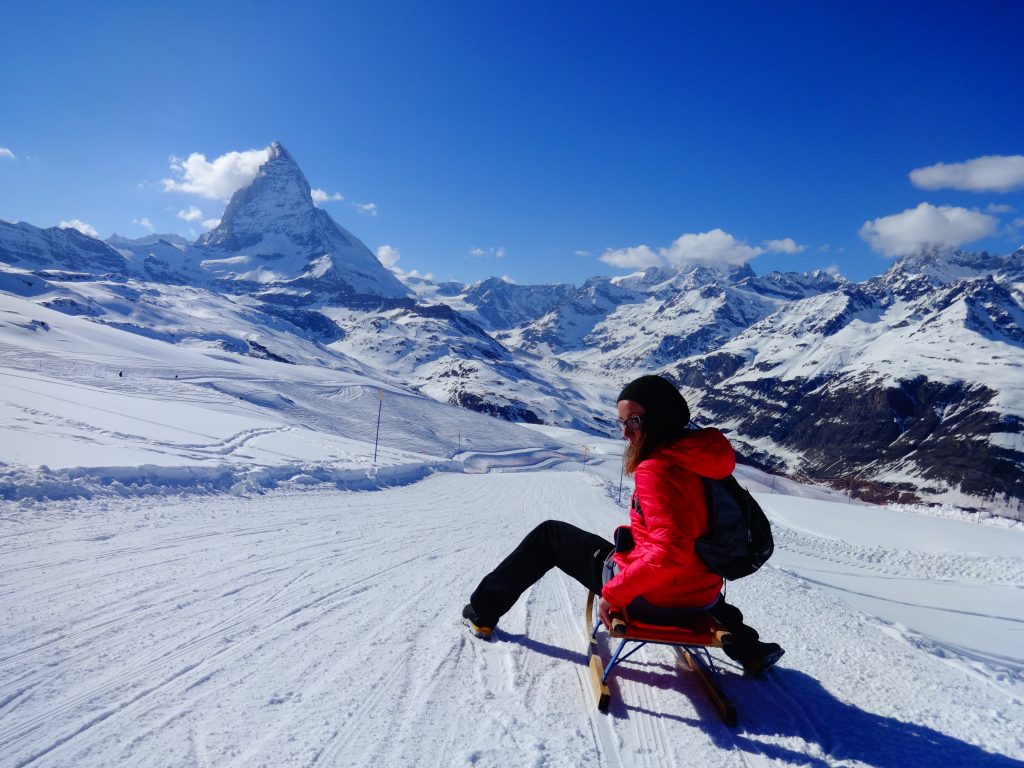 girl sledging in zermatt