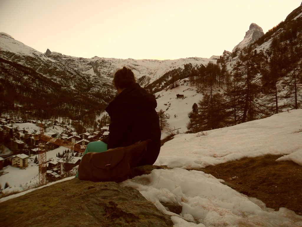 girl sitting in the mountains